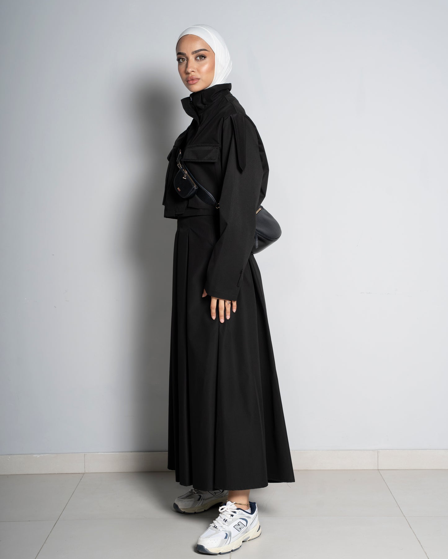 Black Cropped Jacket Paired with Matching Skirt