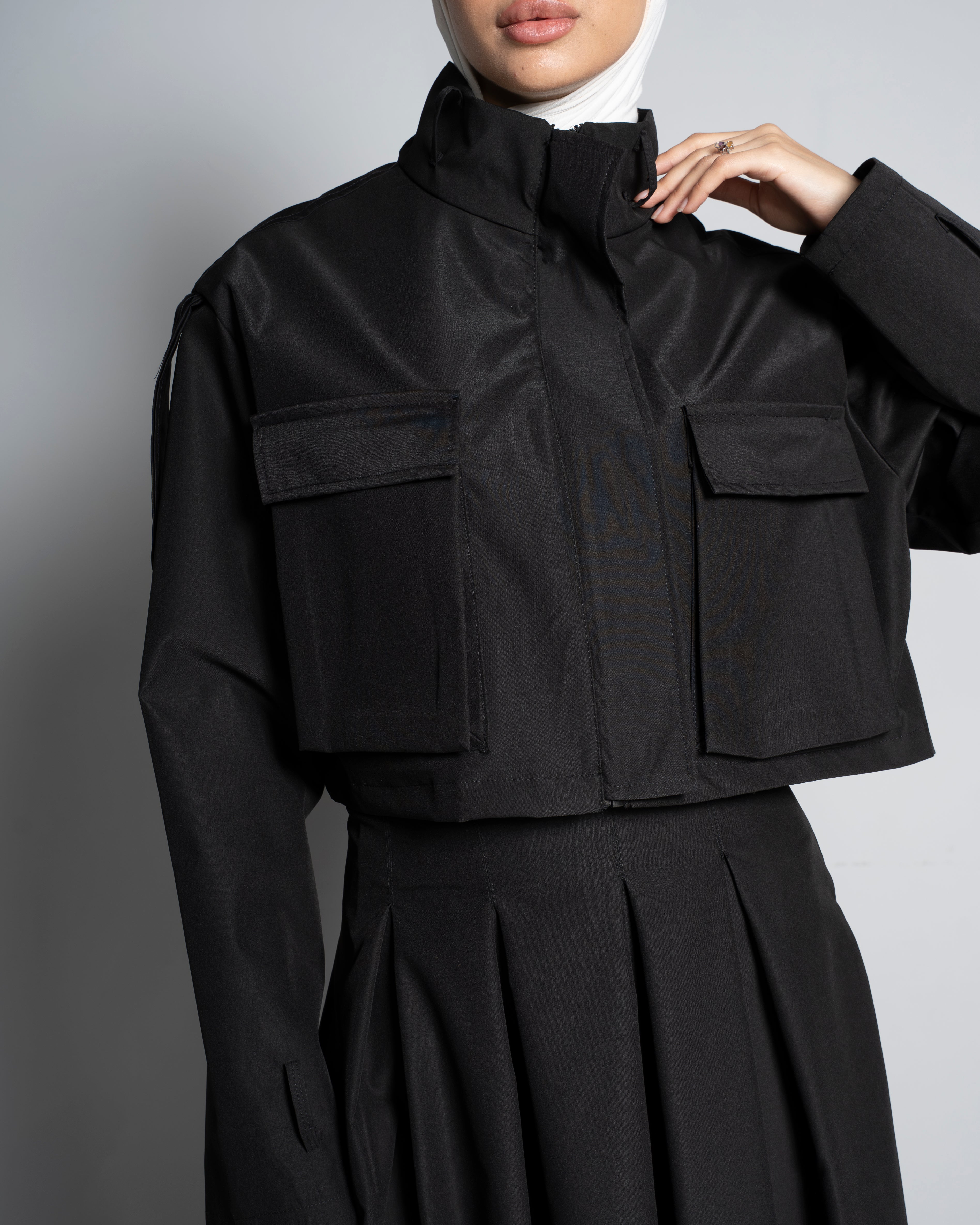 Black Cropped Jacket Paired with Matching Skirt