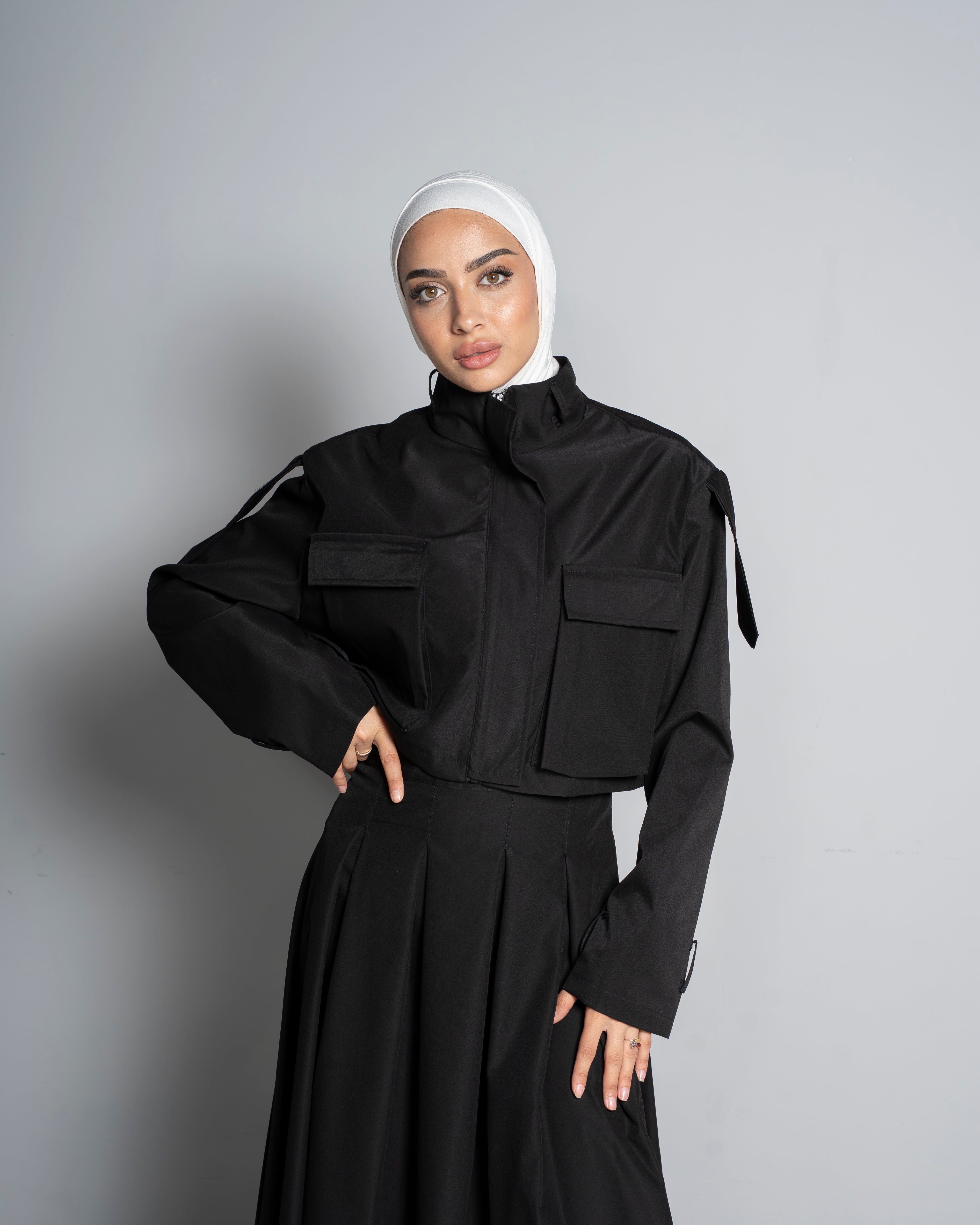 Black Cropped Jacket Paired with Matching Skirt