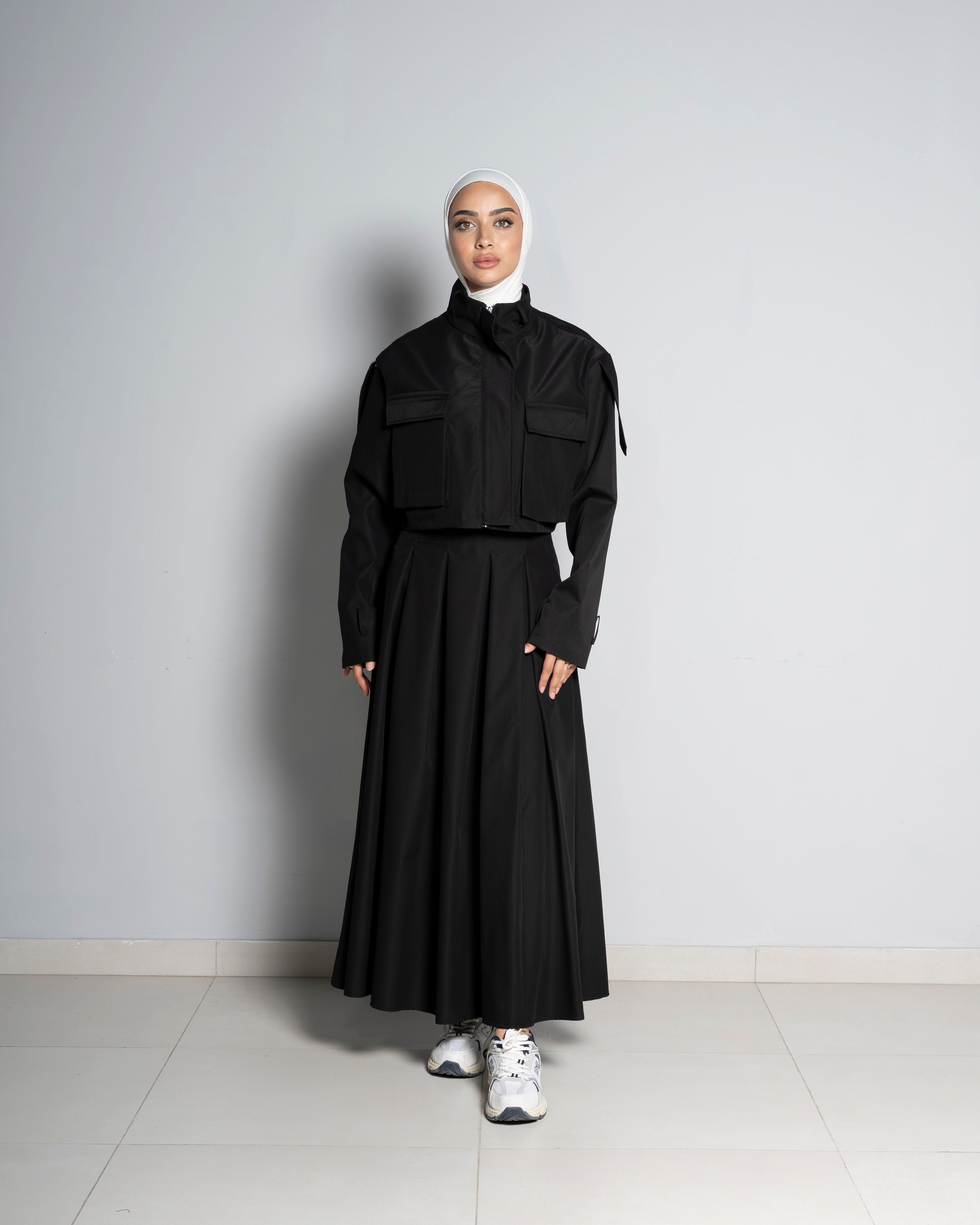 Black Cropped Jacket Paired with Matching Skirt